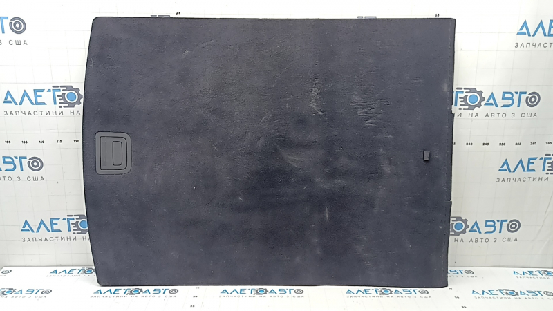The trunk floor of the Audi A5 F5 19-25 5D is black and dented.