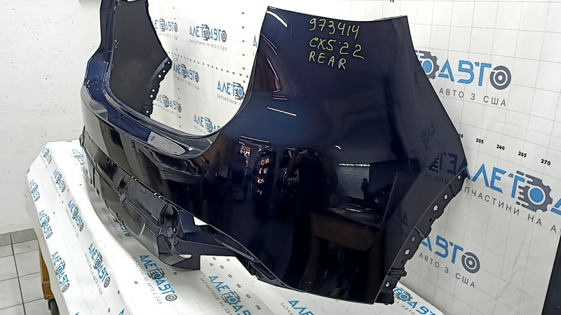 Naked rear bumper for Mazda CX-5 22-25 without parking sensors, blue, scratch, crack in mount