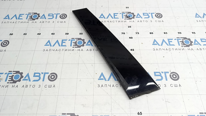 The front right side door trim for a Lexus UX 19-26 is missing a seal, the fastener is broken, and it's covered in glue.