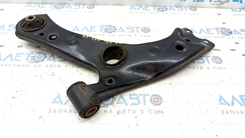 The lower front left control arm of the Lexus UX 19-26 is rusty, with microcracks.