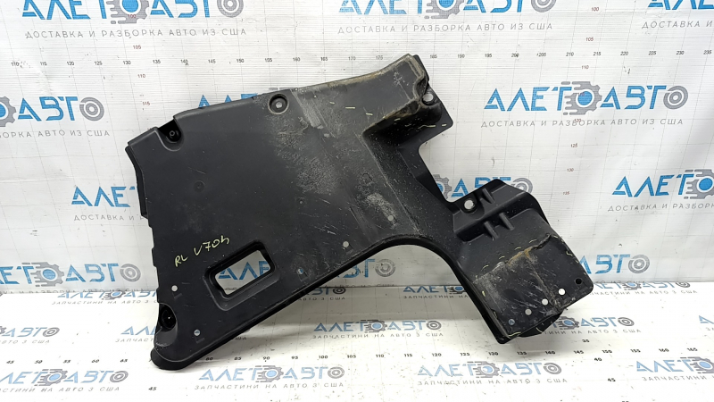 The rear left underbody protection of a Toyota Camry v70 18-24 hybrid is dented.
