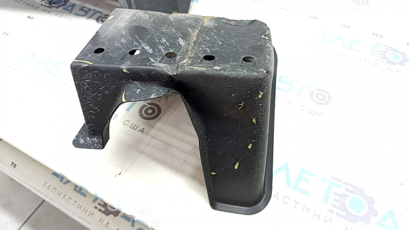 The rear left underbody protection of a Toyota Camry v70 18-24 hybrid is dented.