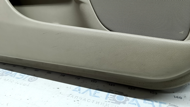 Beige front left door panel for a Lincoln MKZ 17-20, with beige leather insert, beige leather armrest, gray molding, brown upper part, with handle, dry-cleanable, scratches