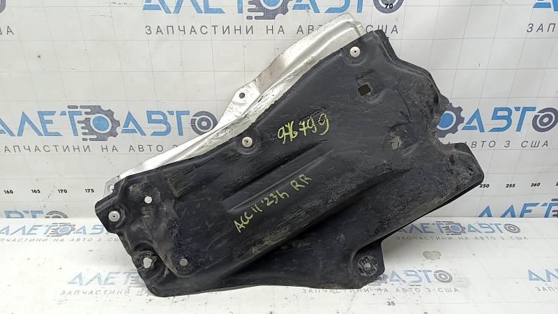 The rear right underbody protection of a Honda Accord 23-26 is pressed and worn.