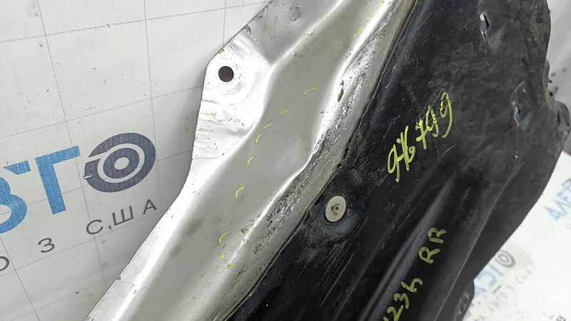 The rear right underbody protection of a Honda Accord 23-26 is pressed and worn.
