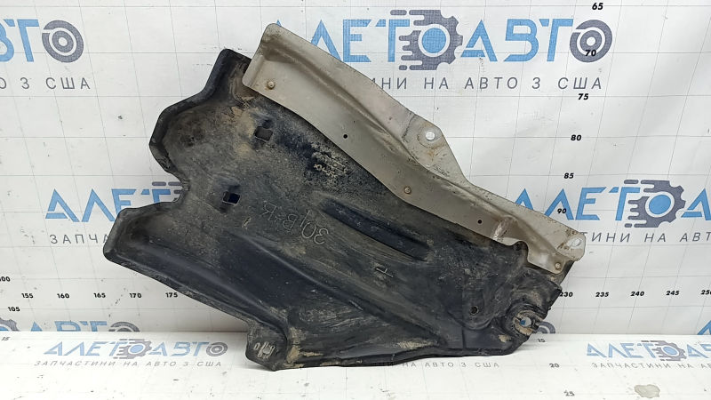 The rear right underbody protection of a Honda Accord 23-26 is pressed and worn.