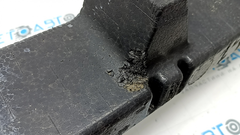 The upper front bumper absorber of a Toyota Rav4 19-24 is broken and missing fragments.