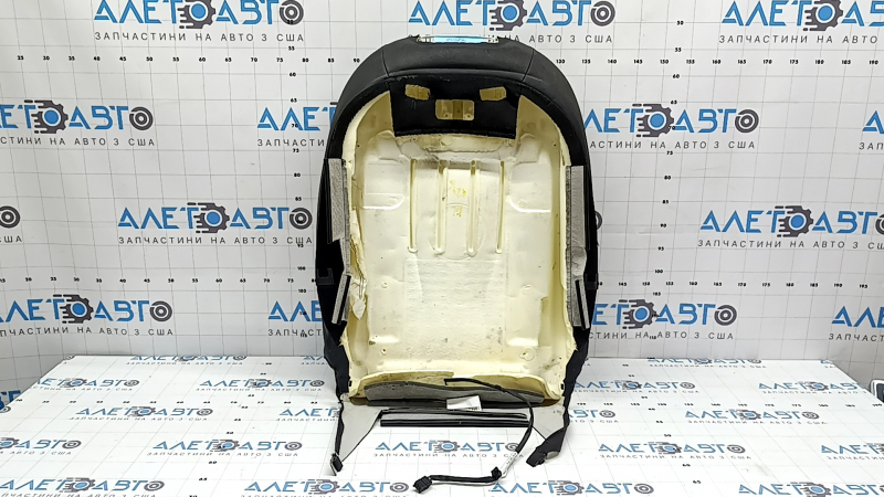 The driver's seat back upholstery for the Audi Q7 16-19 is black leather, heated, and can be dry cleaned