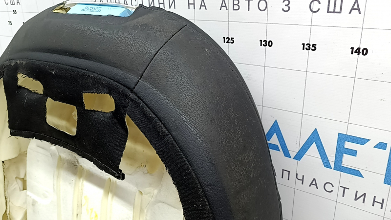 The driver's seat back upholstery for the Audi Q7 16-19 is black leather, heated, and can be dry cleaned
