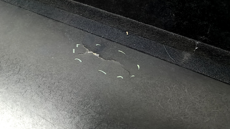 Trunk floor of Honda Accord 17 hybrid, gray, needs cleaning, dented, cracks