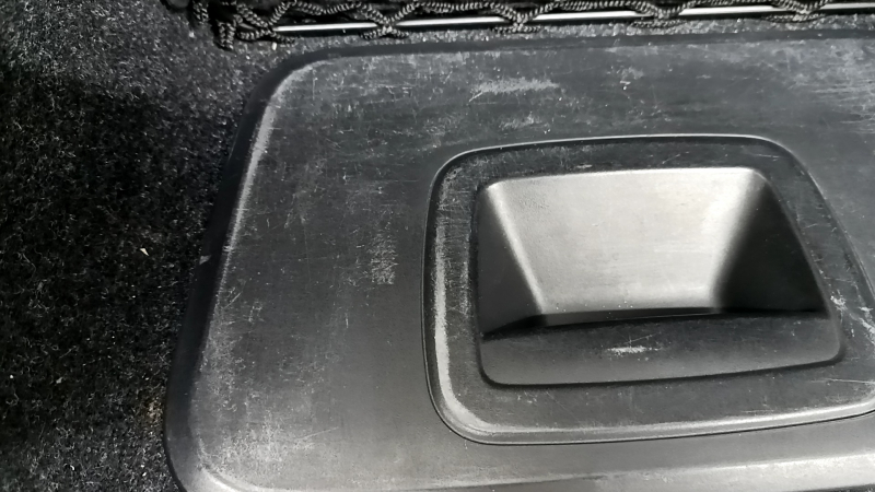 Left arch trim BMW 5 G30 17-23 black, under the first aid kit, scratches on the trim, broken mesh mount