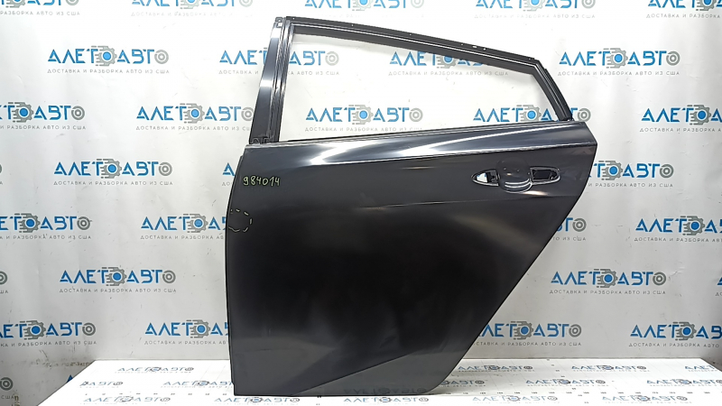 The bare rear left door of a Toyota Prius 50 16-20 is dented