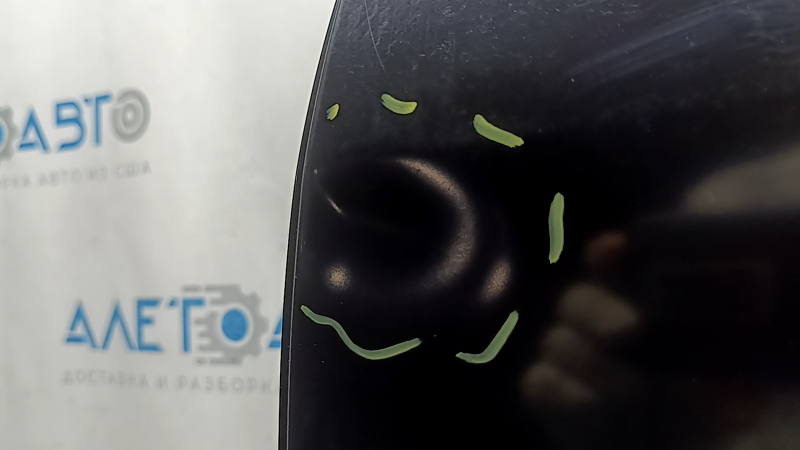 The bare rear left door of a Toyota Prius 50 16-20 is dented