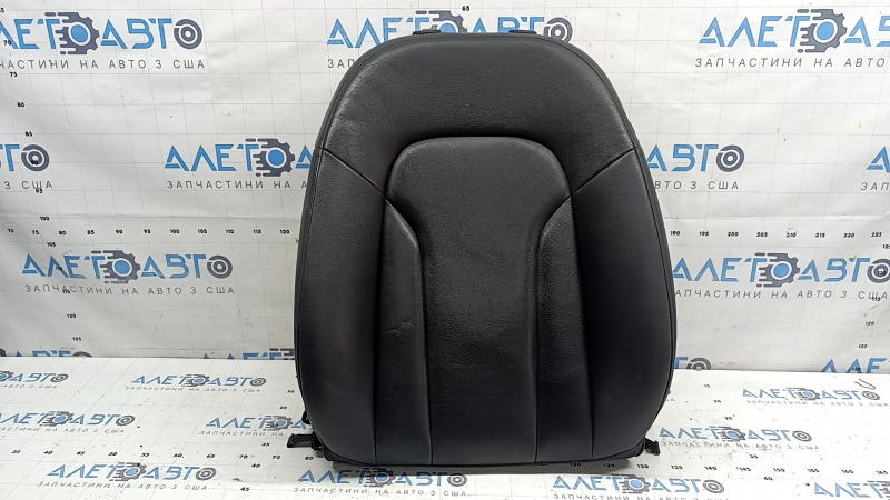 The backrest of the driver's seat of the Audi Q3 8U 15-18 is covered in black leather and heated