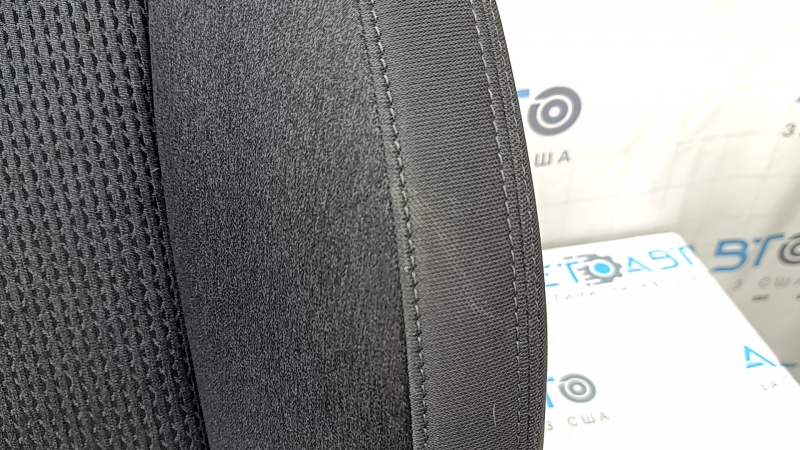 The upholstery of the back of the passenger seat of Hyundai Santa FE 21-23 is black fabric, heated, and can be cleaned