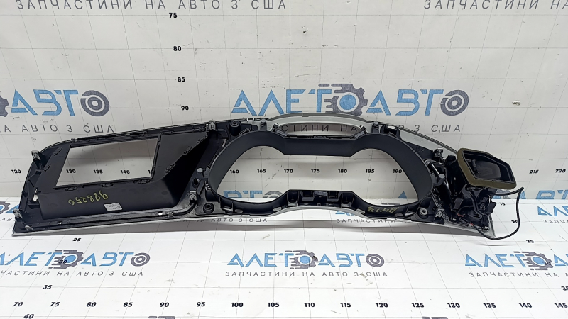 The front panel trim of the instrument panel frame of the Audi A4 B8 08-15 is gray, with an air duct, a crack in the mount
