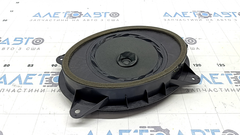 The front left door speaker of the Subaru Forester 14-18 SJ is dented, there is a chip on the housing