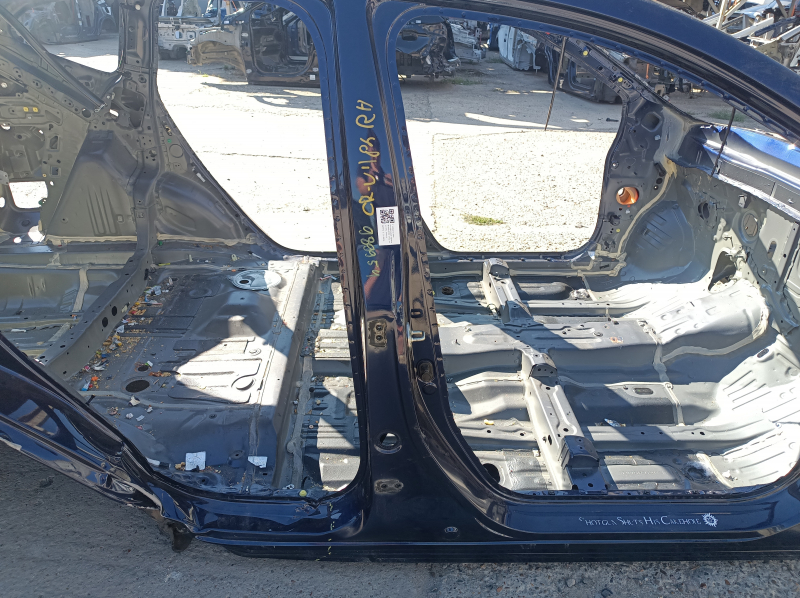 The central right body pillar of a Honda CRV 17-22 is on the body and is dented