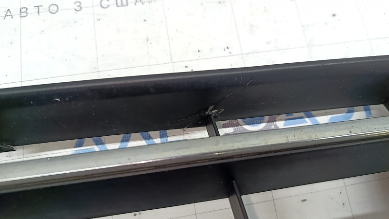 The central grille of the front bumper of the VW Passat b8 16-19 USA is chrome, cracked, fragments are missing