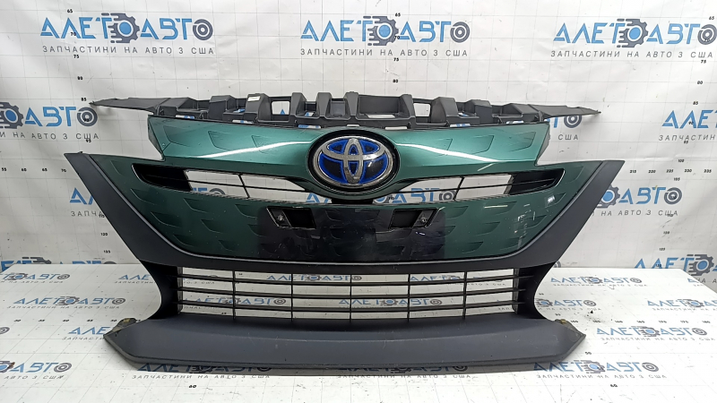 The radiator grille assembly for a Toyota Prius 50 Prime 17-19 with an emblem, under a radar, without parking sensors, cracked, chipped, and a broken mount