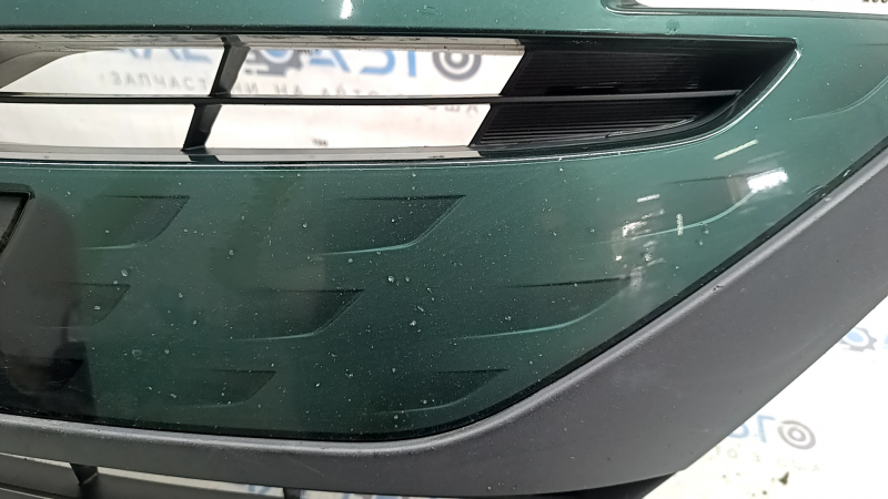The radiator grille assembly for a Toyota Prius 50 Prime 17-19 with an emblem, under a radar, without parking sensors, cracked, chipped, and a broken mount