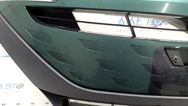 The radiator grille assembly for a Toyota Prius 50 Prime 17-19 with an emblem, under a radar, without parking sensors, cracked, chipped, and a broken mount