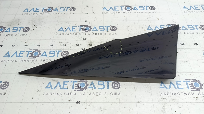 The right rear fender trim of a Toyota Prius 50 Prime 17-22 has peeling paint and is cracked