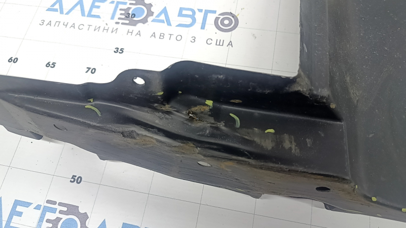 The left side engine protection of Toyota Prius 50 16-18 is worn, torn, and dented