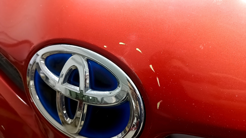 Front bumper assembly for Toyota Prius 30 12-15 rest, red, with tow hook plugs, grilles, emblem, and frame, scratches, cracks, non-factory holes