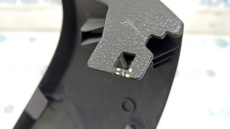 The driver's seat control cover for the Audi A6 C7 12-18 is black, with scratches and a crack in the mount
