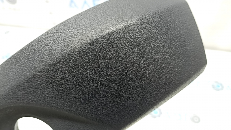 The driver's seat control cover for the Audi A6 C7 12-18 is black, with scratches and a crack in the mount