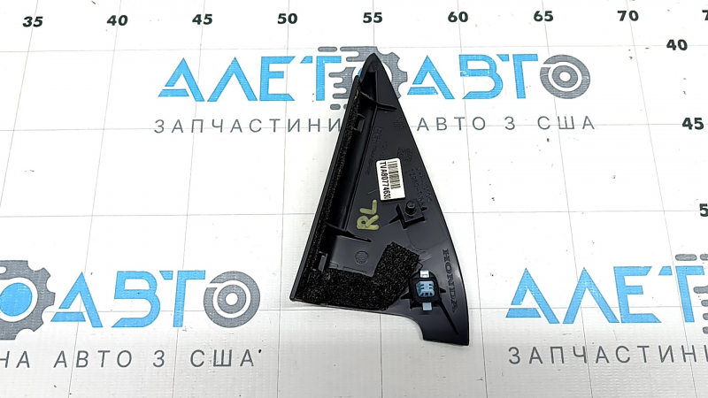 Triangle plug inside the rear left door of a Honda Accord 23-26, black