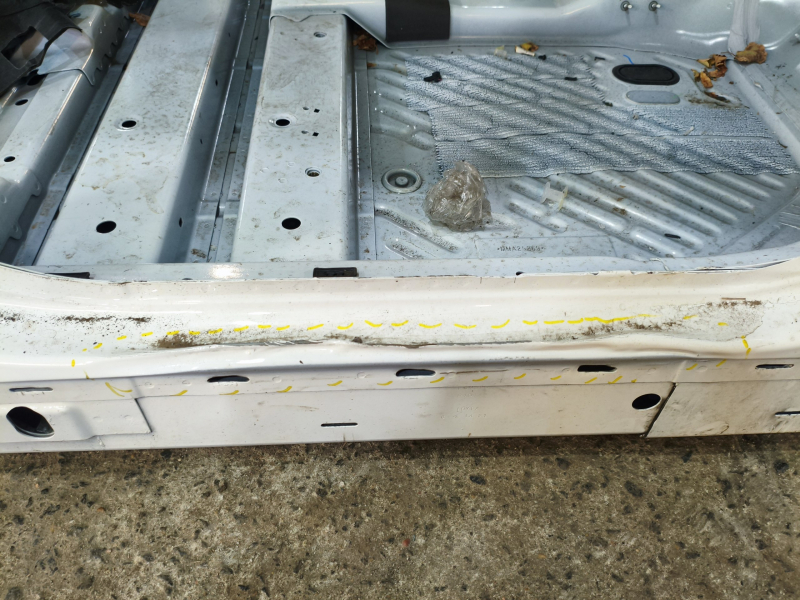 Front right quarter of Ford Mustang Mach-E 21-26 white A3, on the body, dented