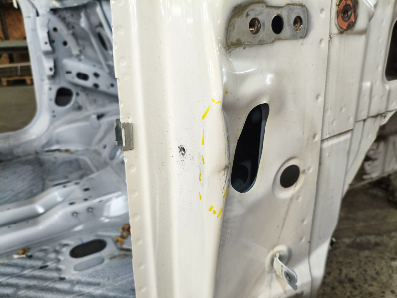 Front right quarter of Ford Mustang Mach-E 21-26 white A3, on the body, dented