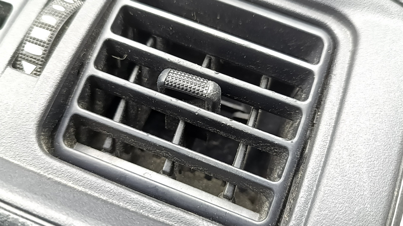 Center console trim with air vent deflector for Toyota Rav4 19-25 under cigarette lighter, black, scratches