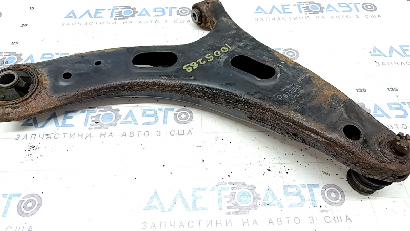 The lower front left control arm of a Subaru Forester 19-24 SK is rusty and the silent block is torn