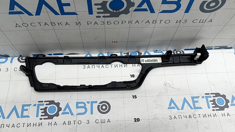 The front panel trim, climate control frame, Kia Niro 17-17, is black, covered in glue, has nicks and scratches
