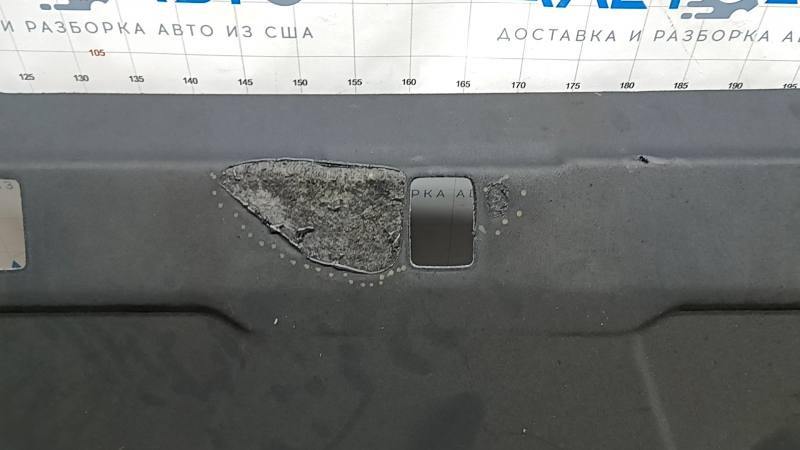 The rear shelf of the Audi A3 22-26 is black and melted