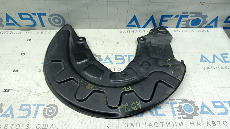 The front left brake disc cover of the Audi A3 22-26 is dented