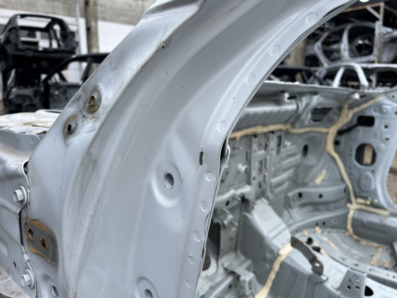 Front left quarter of Honda Accord 23-26 on the body, white, dented pillar