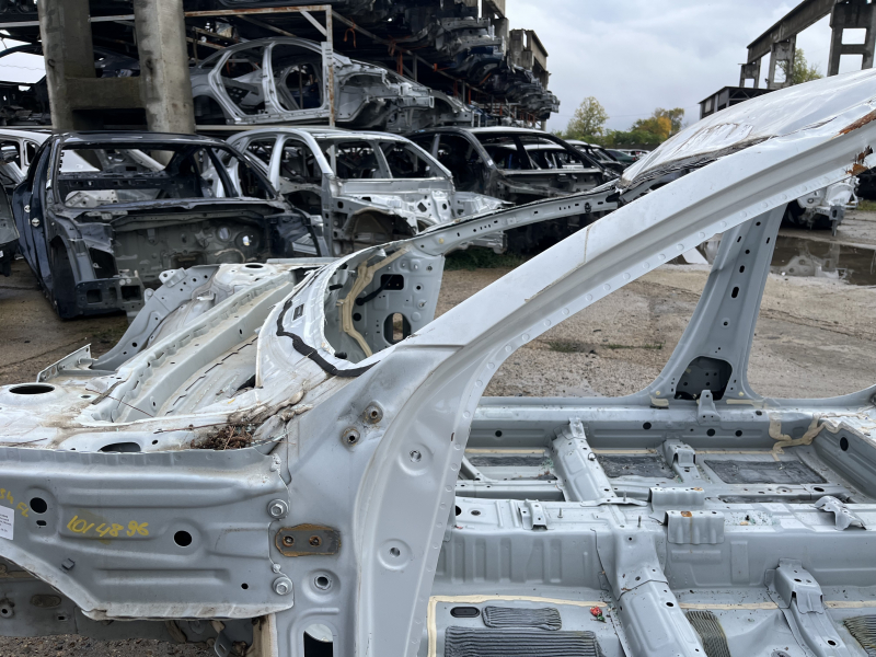 Front left quarter of Honda Accord 23-26 on the body, white, dented pillar