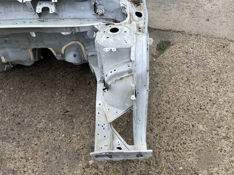 Front left quarter of Honda Accord 23-26 on the body, white, dented pillar