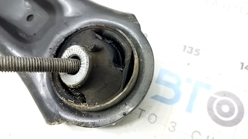 The lower front left control arm of a VW Taos 22-24 has a torn silent block