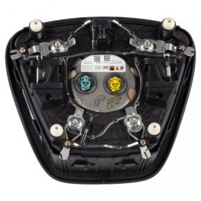 The steering wheel airbag for the driver's side of the Ford Bronco Sport 2021-2025 is black and has a rusty squib.