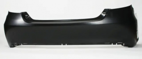 The rear bumper of a Toyota Camry V55 15-17 USA is black and dented, torn, and has broken fasteners.
