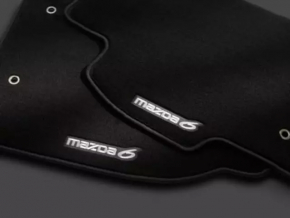 Black fabric floor mat for the front right Mazda 6 14-21, with worn lettering