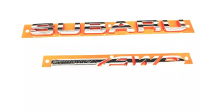 The SUBARU AWD emblem is on the trunk door of a 1996 Subaru Crosstrek.