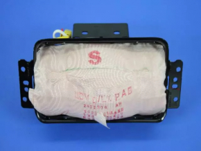 Passenger airbag in the dashboard of a 2014 Dodge Challenger.